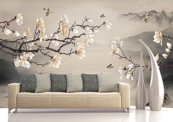 Ramuri de magnolie înflorite pe un fundal bej de peisaj montan