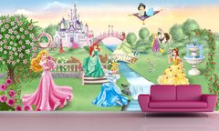 Сказочные принцессы в разноцветных платьях на прогулке возле замка