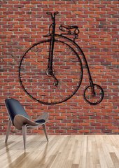Старинный велосипед на кирпичном фоне