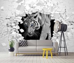 Белый тигр с синими глазами на фоне разбитой кирпичной стены