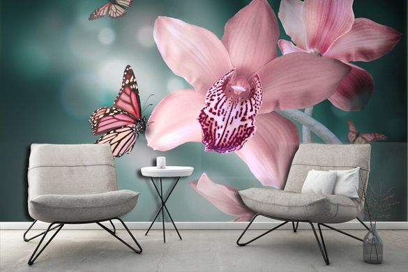 Бабочки и розовые орхидеи на зеленом фоне