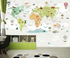 Разноцветная детская карта мира на пастельном зеленом фоне