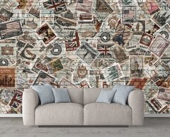 Коллаж из марок разных стран на кирпичной стене