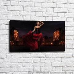 Fată într-o rochie roșie pe fundalul unui design flamenco
