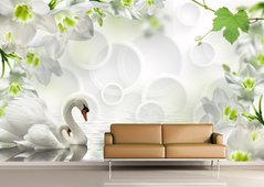 Белые лебеди на пруду на фоне цветов