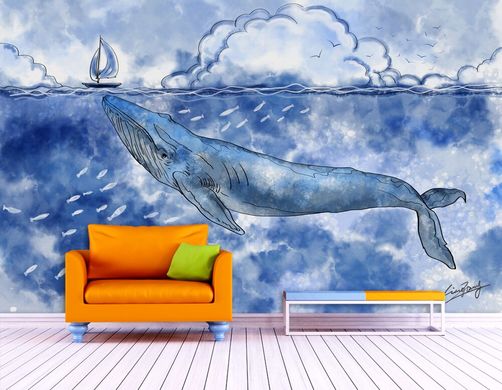 Большой кит под водой у мальенького парусника