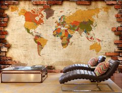 Harta multicolora a lumii pe fundal de perete de caramida