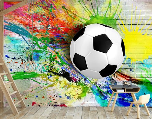 Футбольный мяч на фоне разноцветных брызг красок