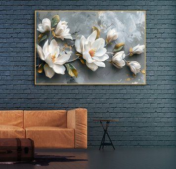 O ramură de magnolii cu flori și frunze mari, pe fundal gri
