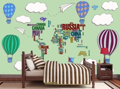 Абстрактная карта мира из названий стран на зеленом фоне с воздушными шарами